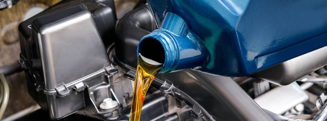 Unknown person pouring fresh oil