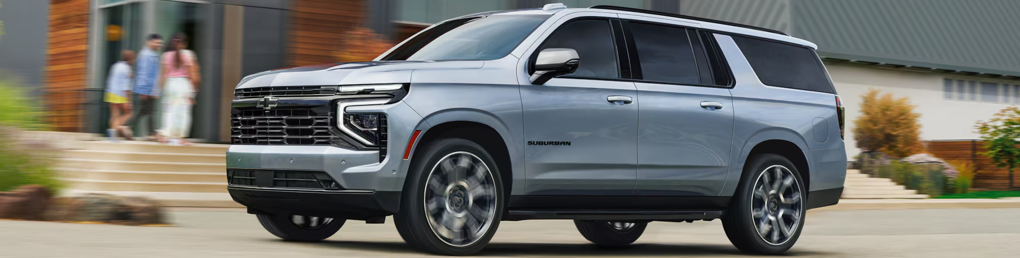 2026 Chevrolet Suburban driving down street