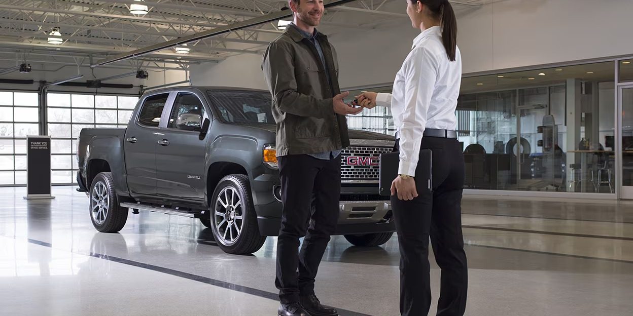 Sales person speaking to customer
